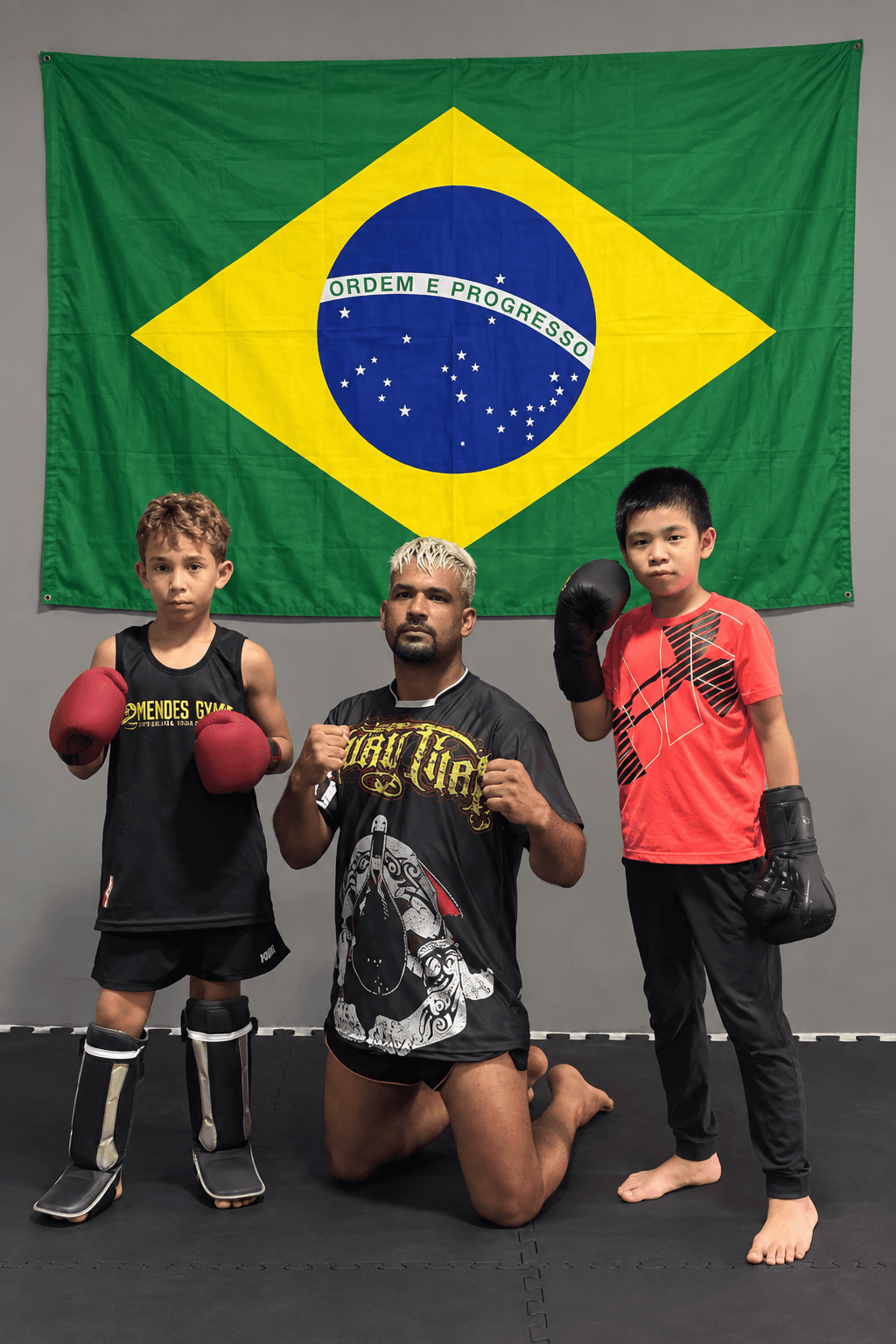 George with coach Michel Mendes and training partner Breno in Guarapari, Brazil