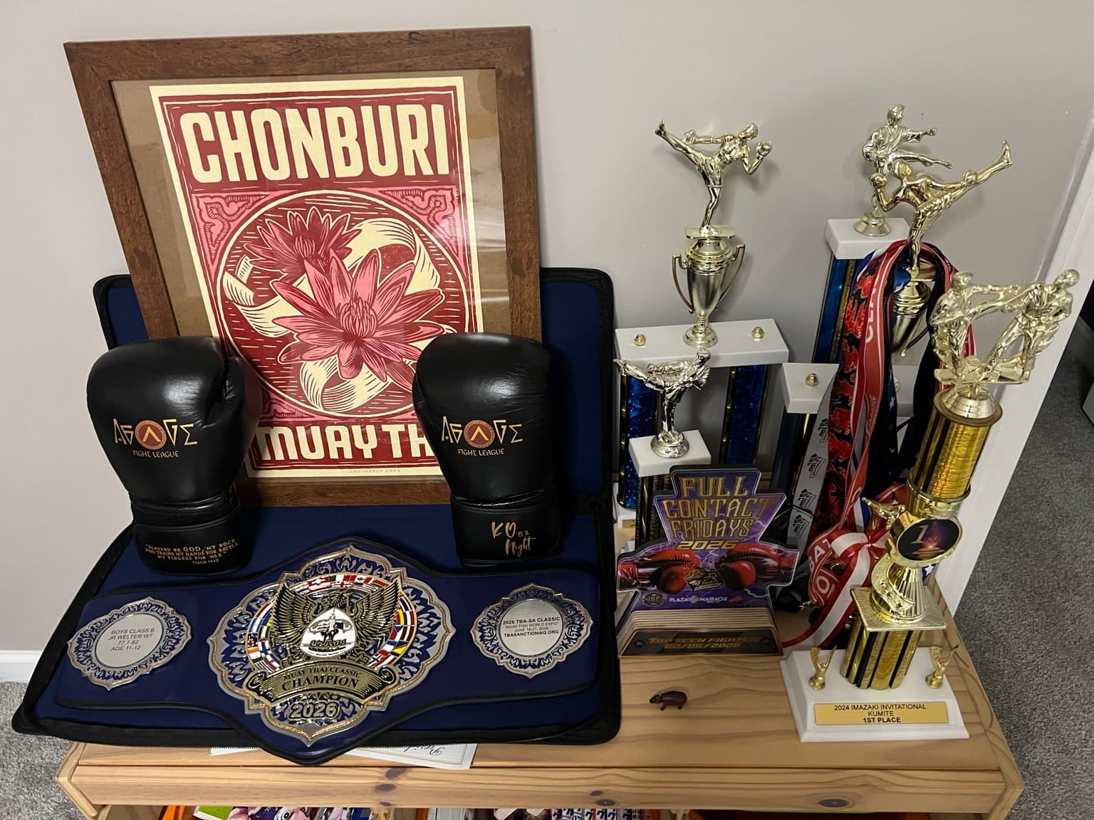 Belt, trophies, medals, and gloves